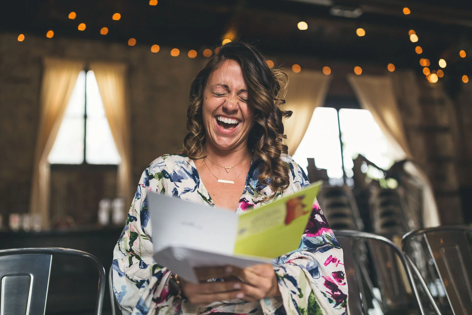 Bride laughs at card from groom
