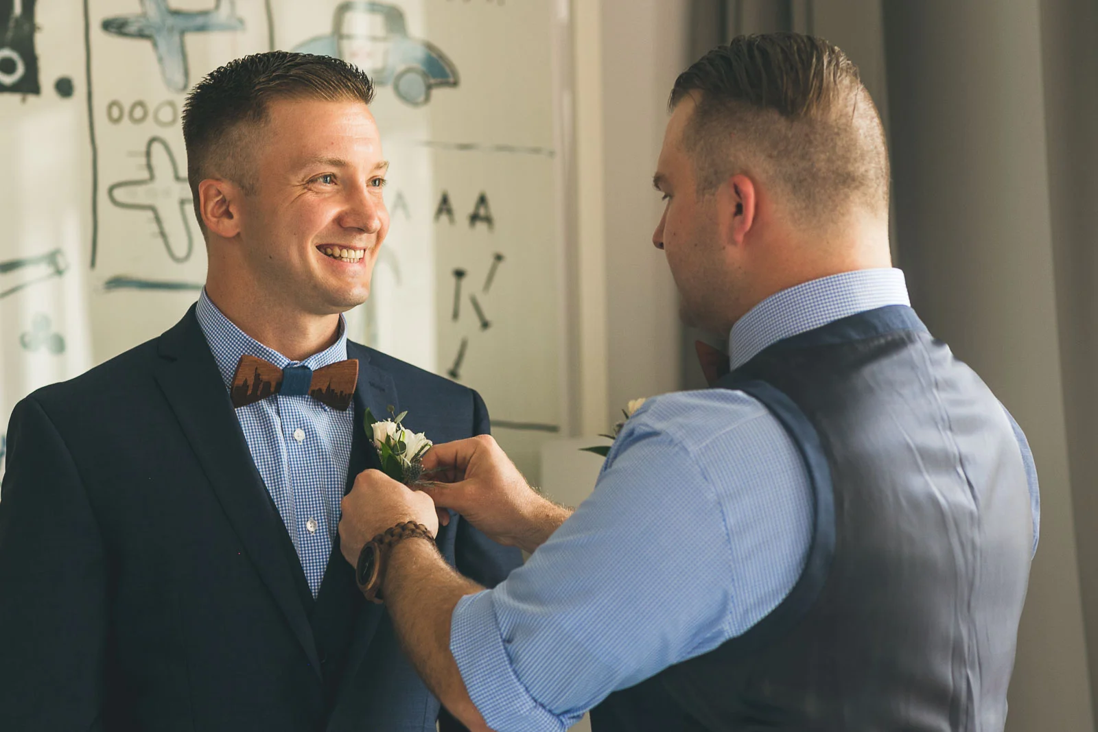 Best man helps groom