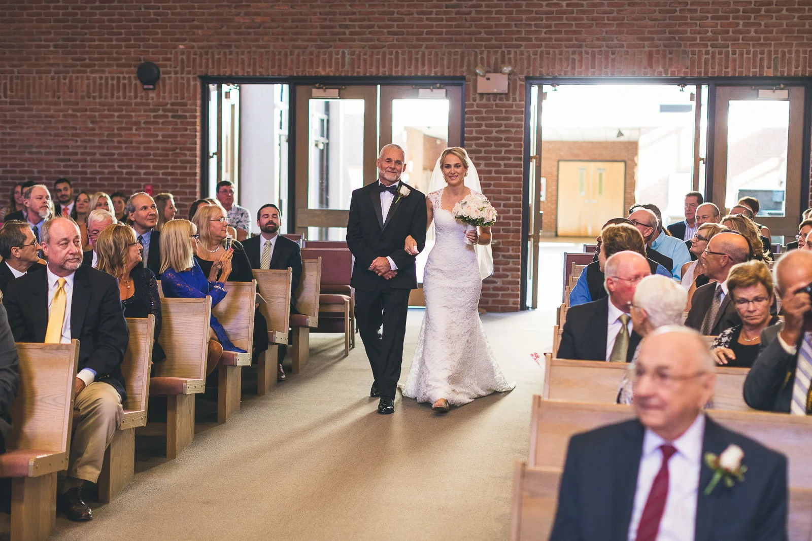 Father of Bride Walks down aisle