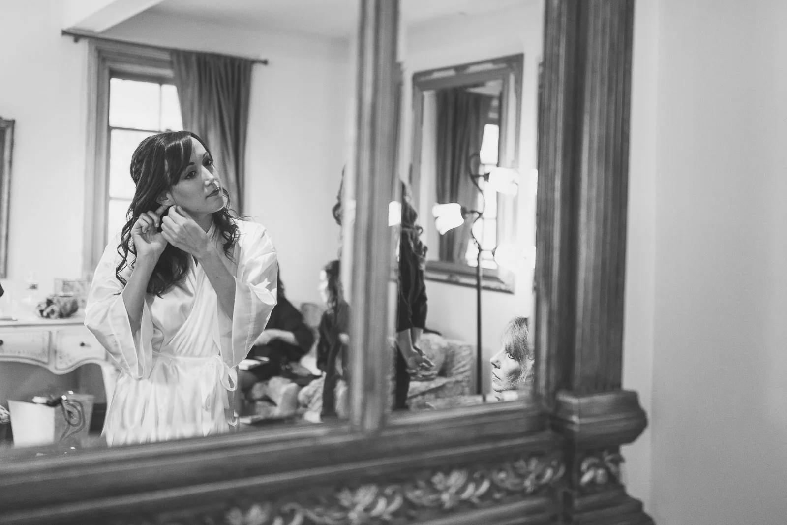 Bride puts on ear rings