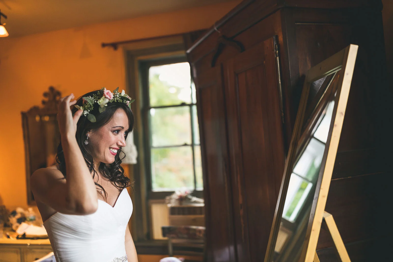 Bride puts flower crown on
