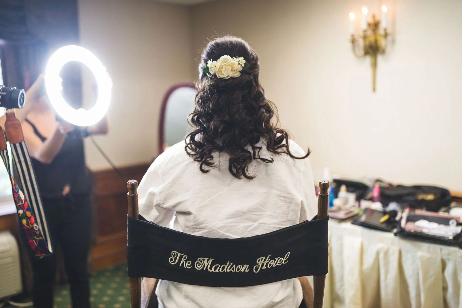 Bride finishes hair and makeup