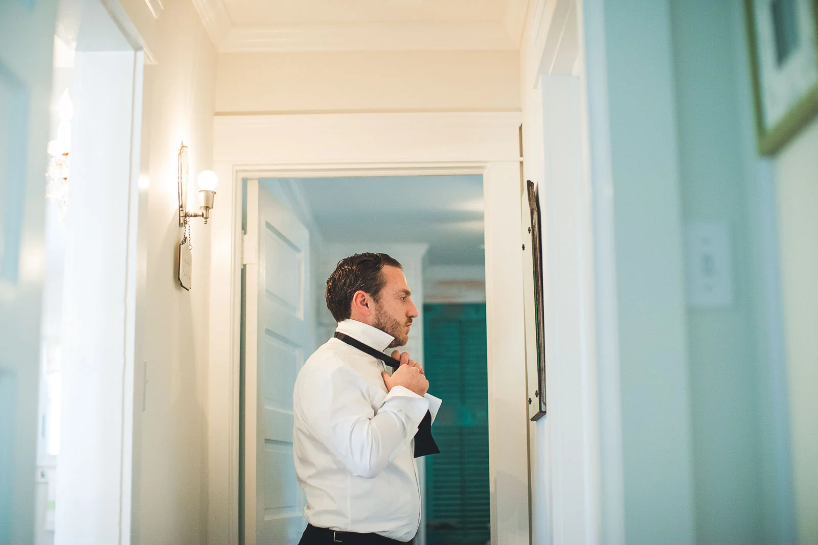 Groom gets tie on
