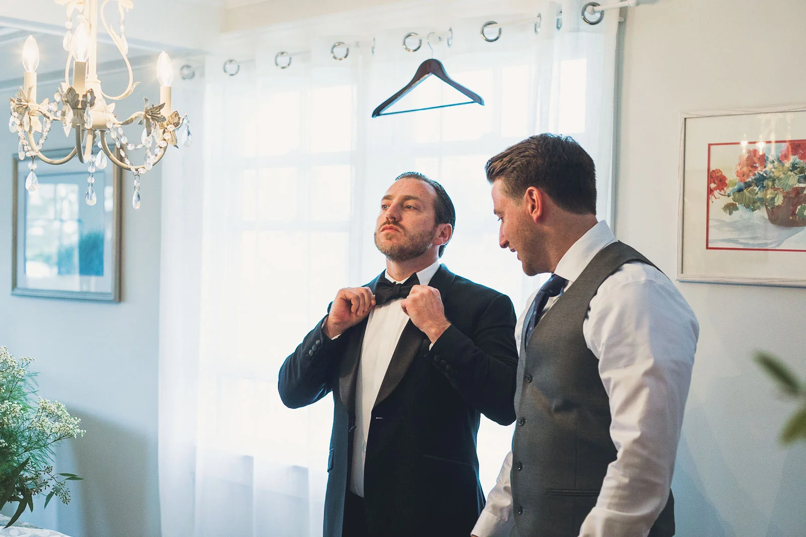 Groom adjusts tie