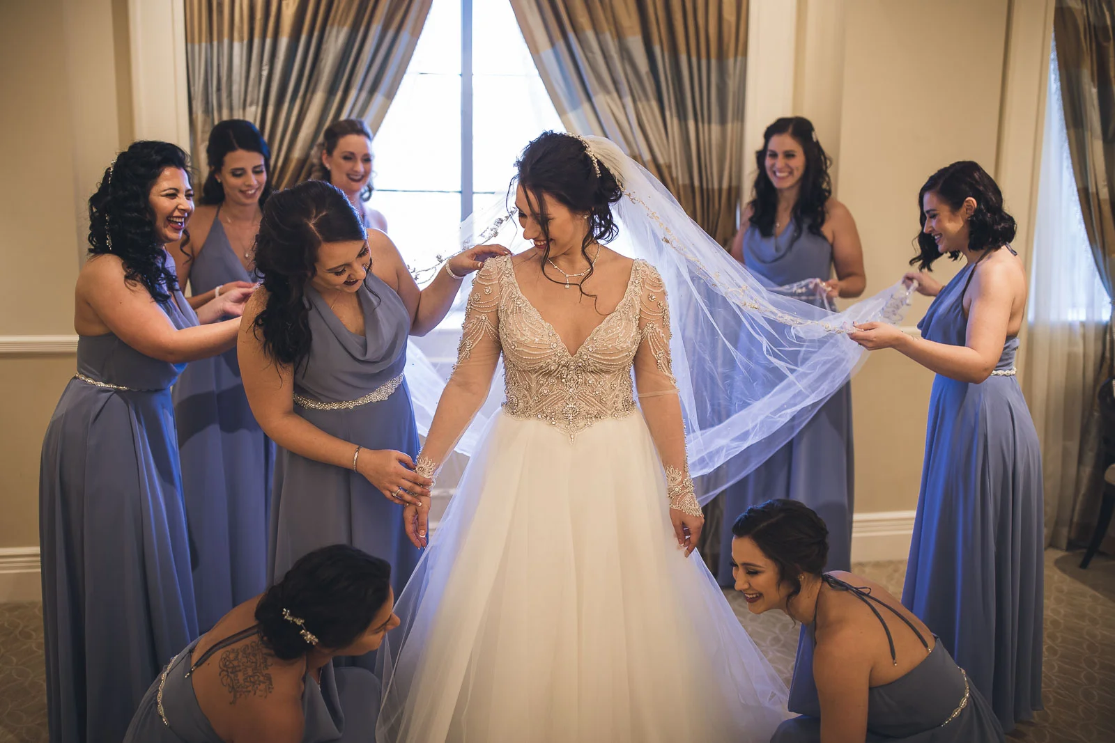 Bridal Party helps with dress at The Grove