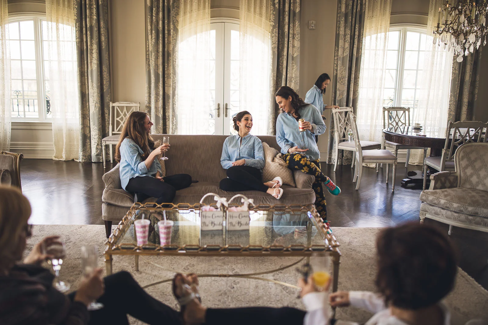 Bride laughs with bridal party