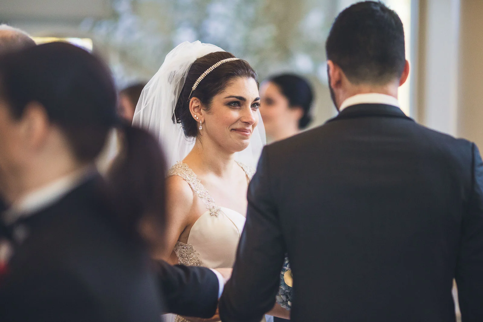 Bride smiles at Groom