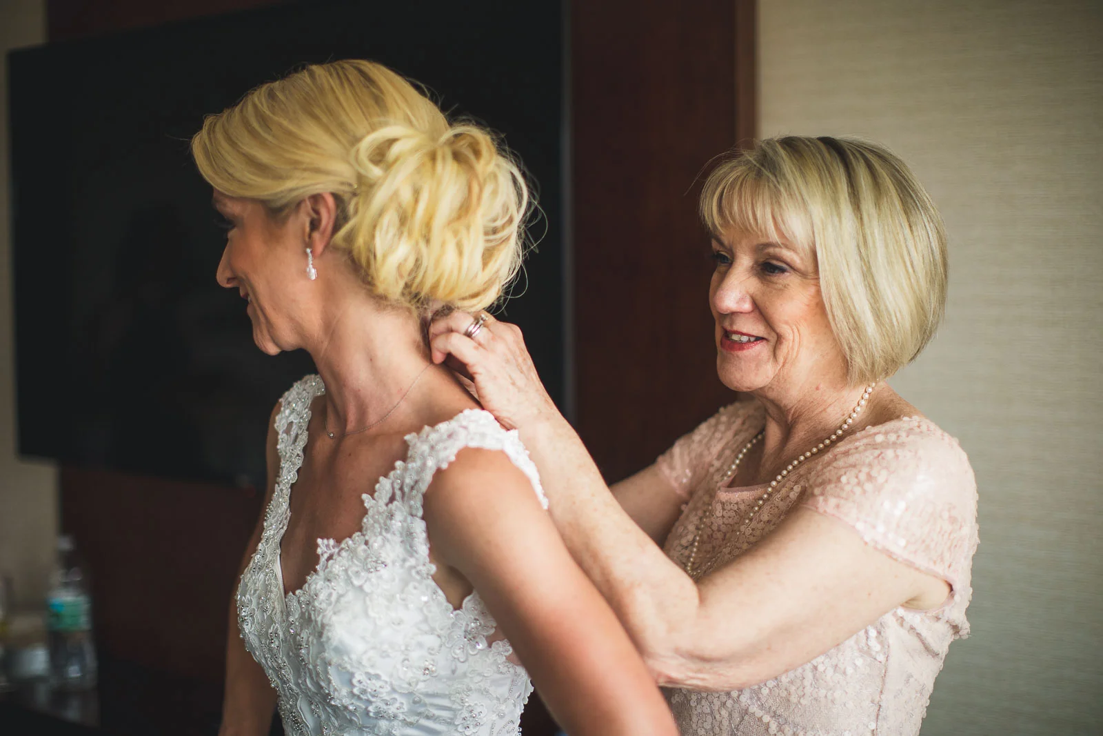 Mom helps with necklace