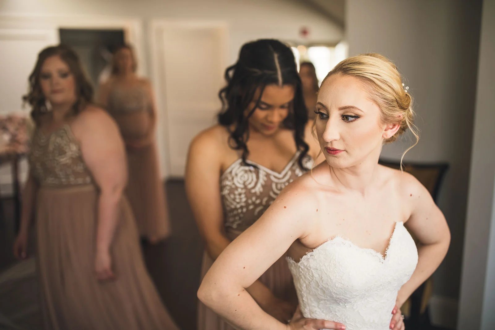 Bride gets on dress