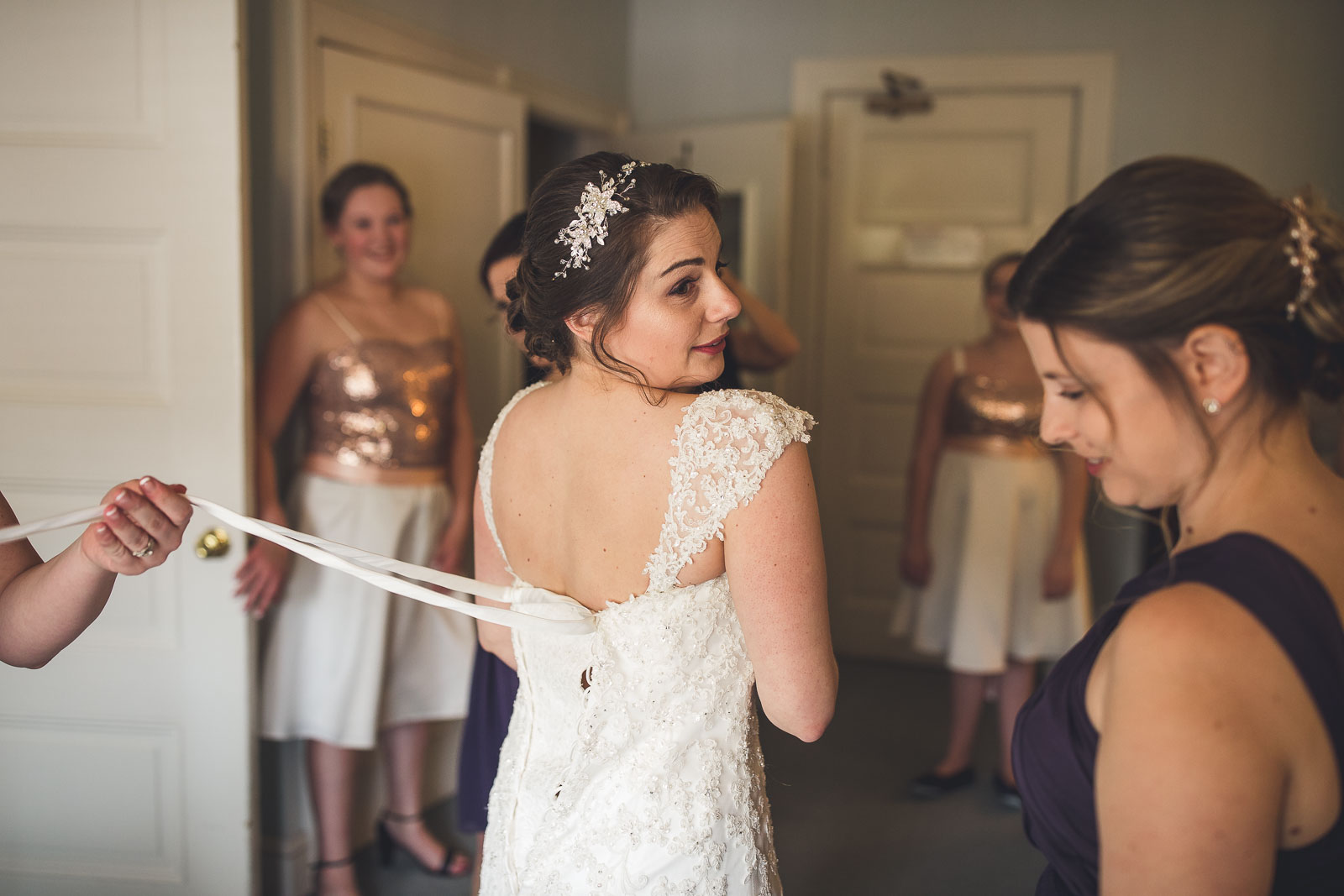 Bride getting dress on