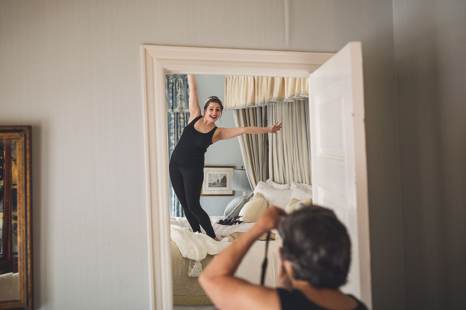 Bride bouncing on bed