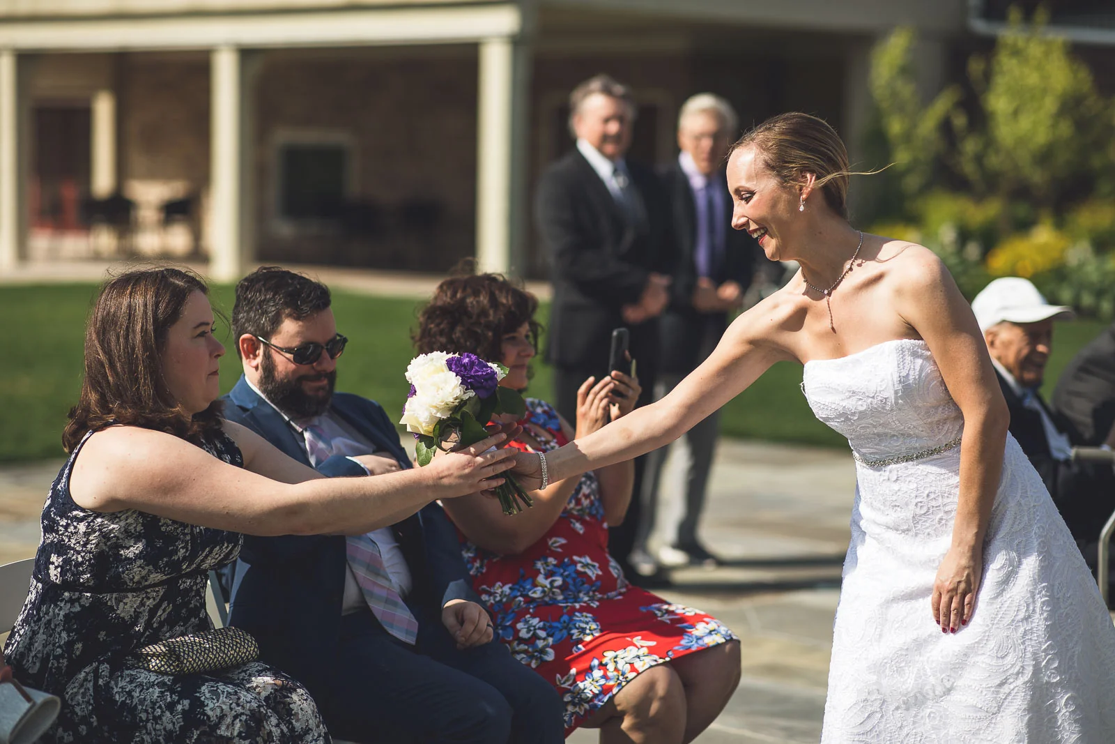 Bride hands off flowers Flanders Valley