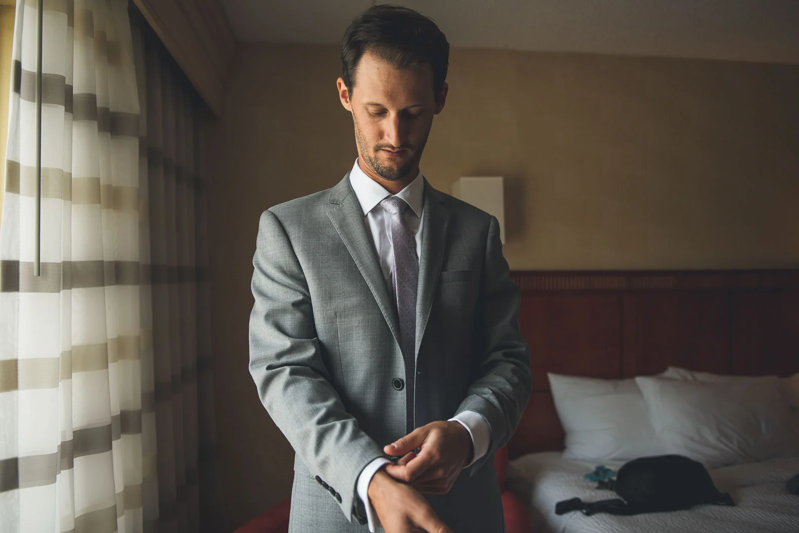Groom puts on suit