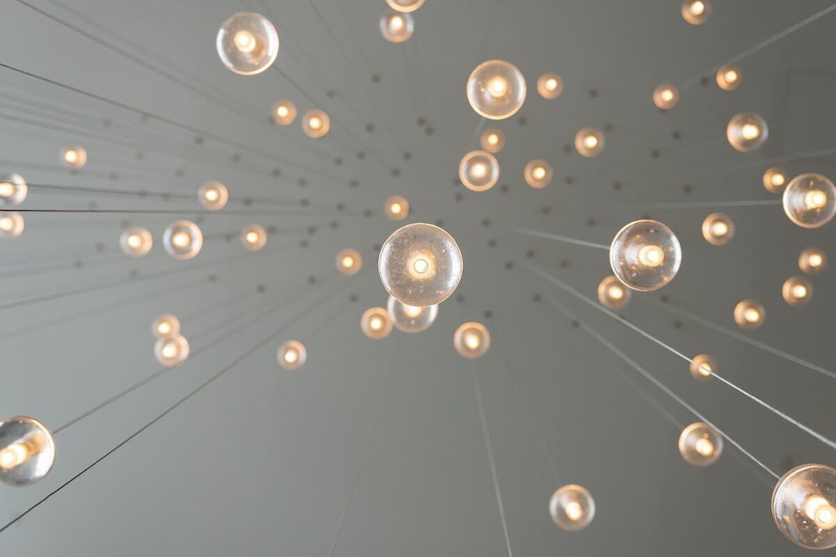 Photo of upclose incoming light bulbs on strings by Skye Studios on Unsplash