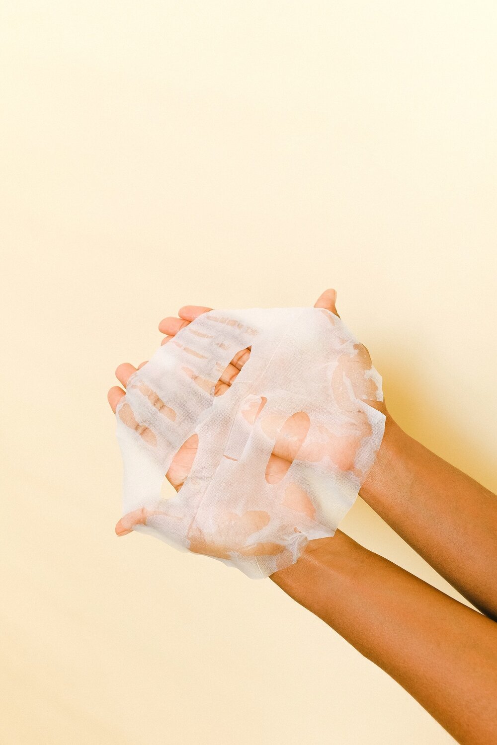 Photo of person holding a sheet mask for skincare on mellow yellow background by Anna Shvets from Pexels