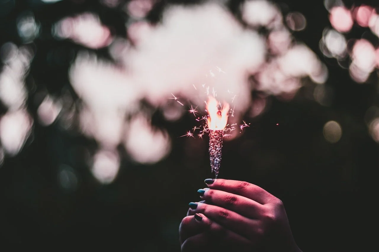 Photo of a person holding a sparkler by Rahul Pandit from Pexels