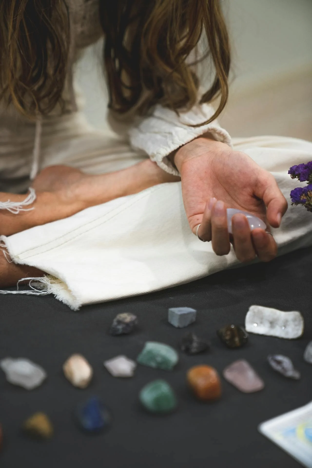 Woman holding crystal by Los Muertos Crew