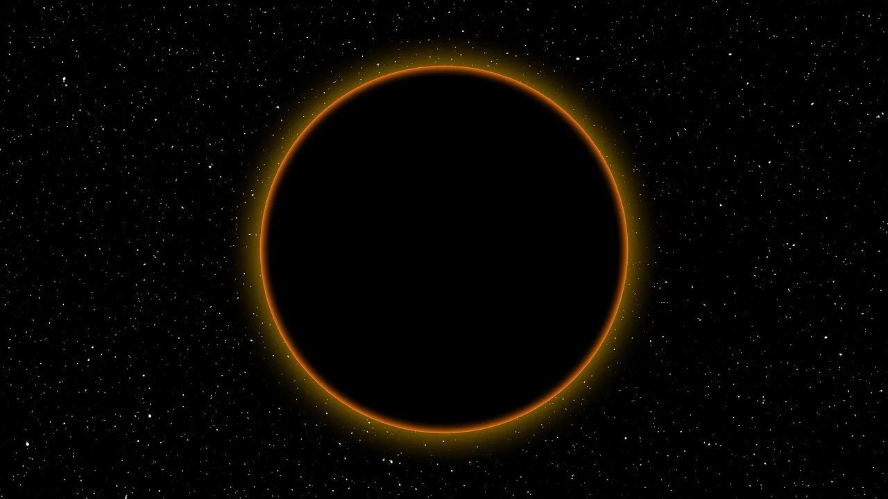 Photo of ring of light in dark speckled background by A Owen from Pixabay