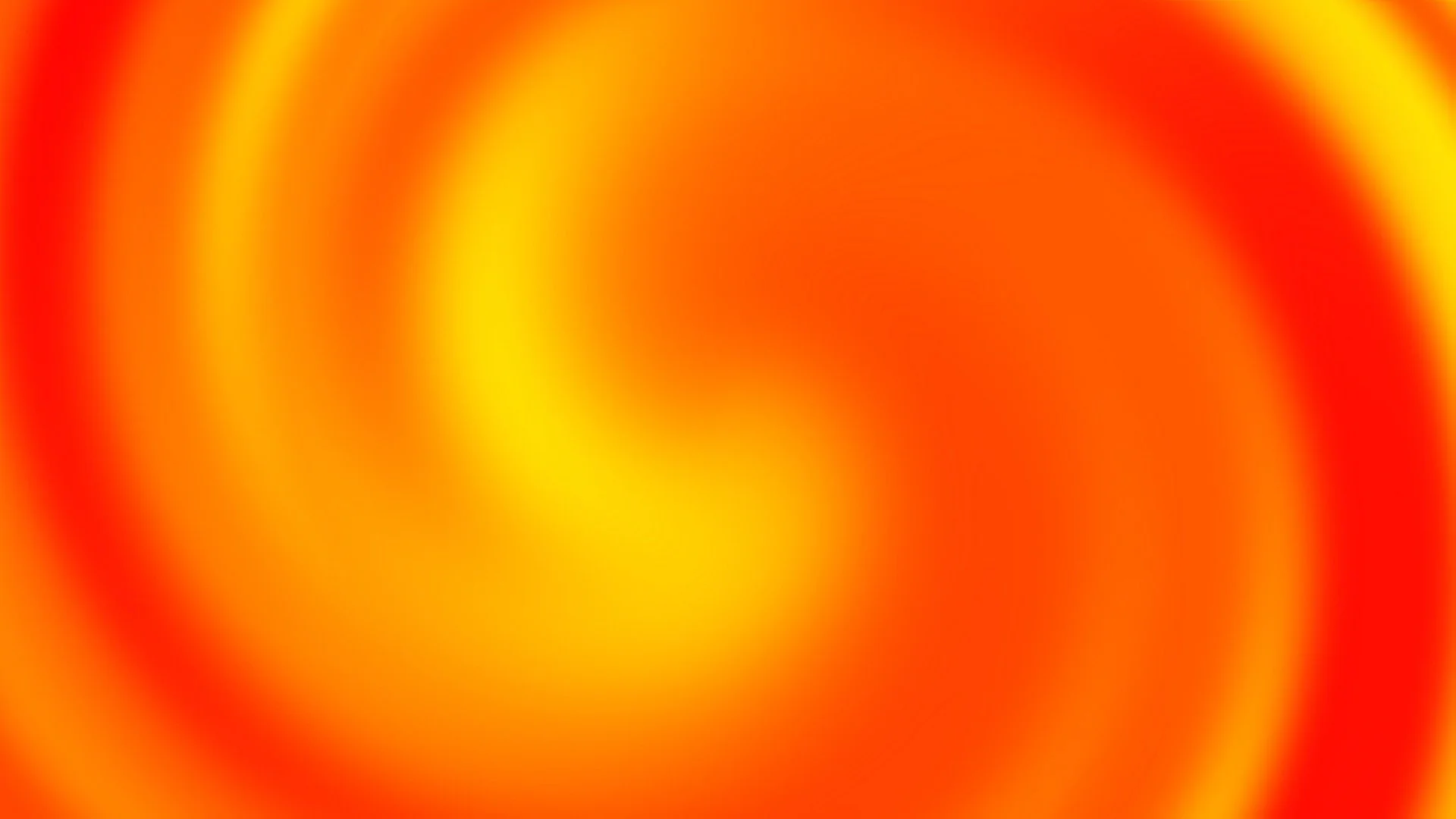 abstract blurred swirl of red, orange, and yellow colors.