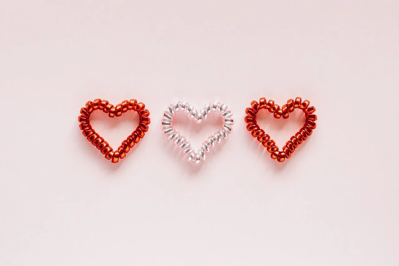 Photo of three heart shaped coils in a row by Karolina Grabowska from Pexels