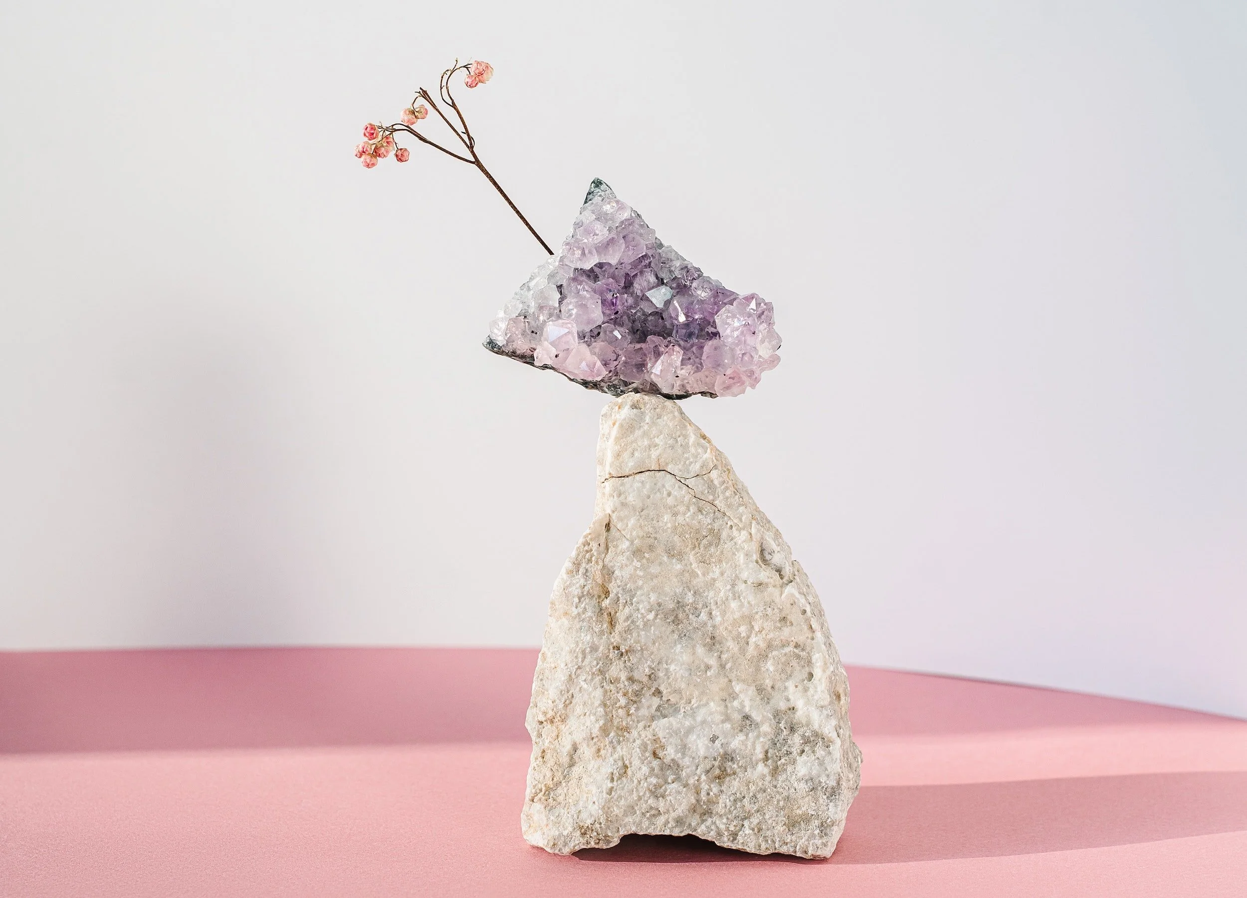 Photo of quartz stone balancing amethyst by Mikhail Nilov from Pexels