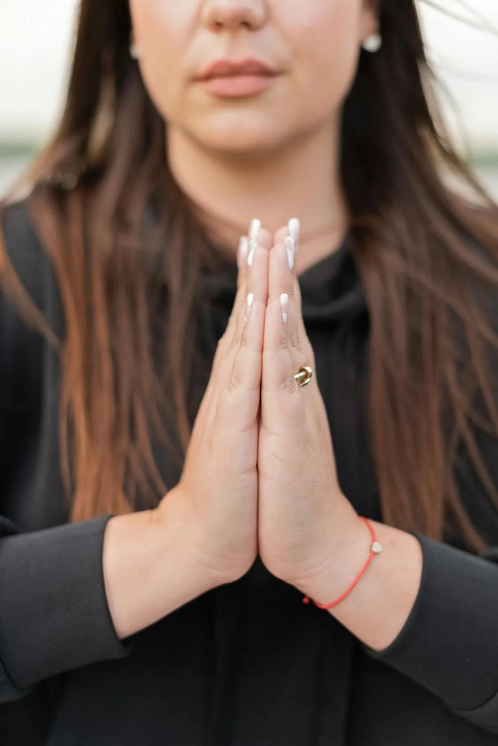 Person with hands in prayer position by Mikhail Nilov on Pexels