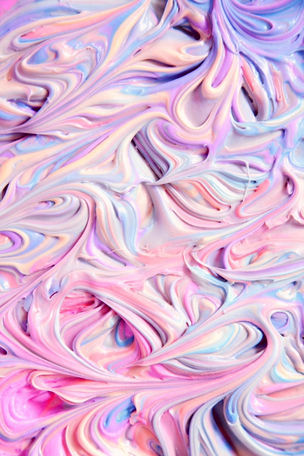 Photo of pastel rainbow swirls in gel substance by Alexander Grey on Pexels