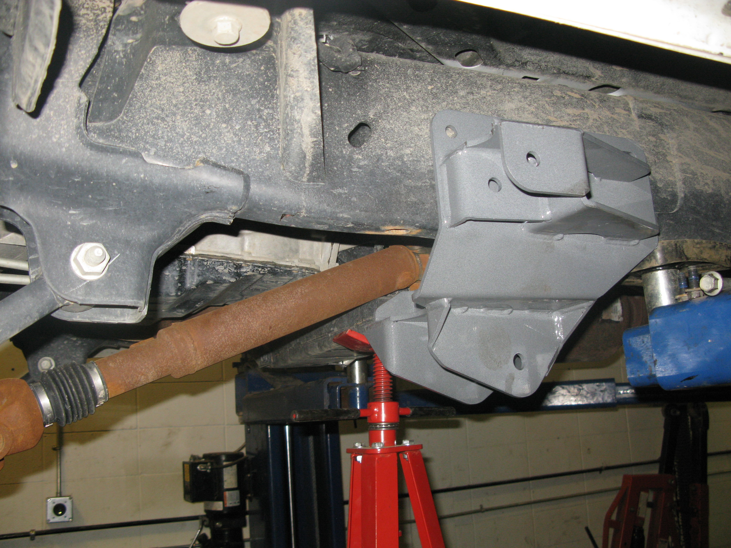 Here you can see the new control arm frame mount on the right and the factory mount on the left