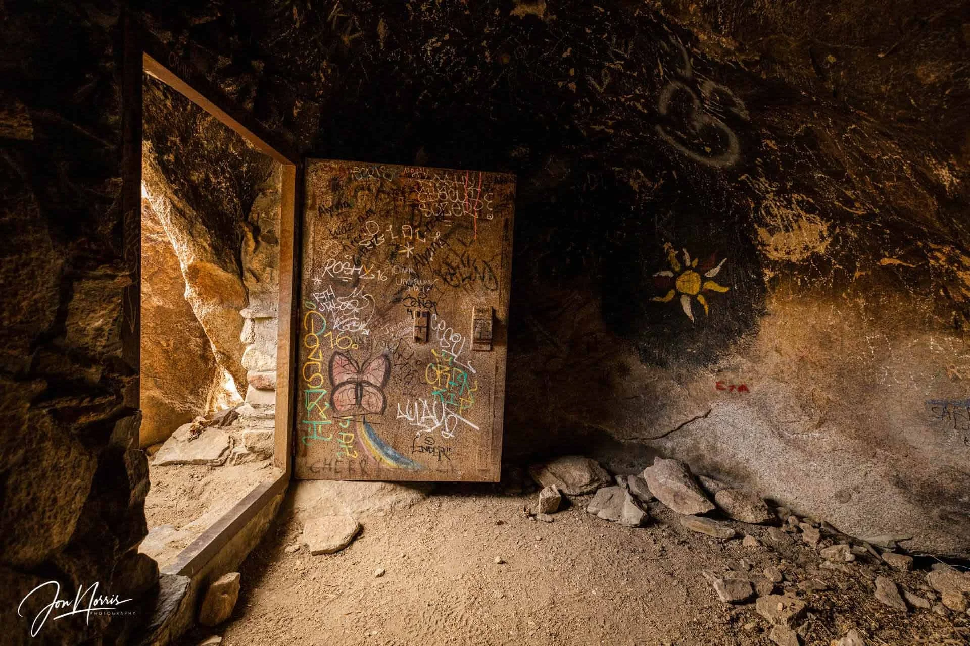  The Iron Door   This definitely fits into the category of curiosities within the park. A large iron door forms a closed cave under a large boulder.    Fine art, metal, or acrylic prints  