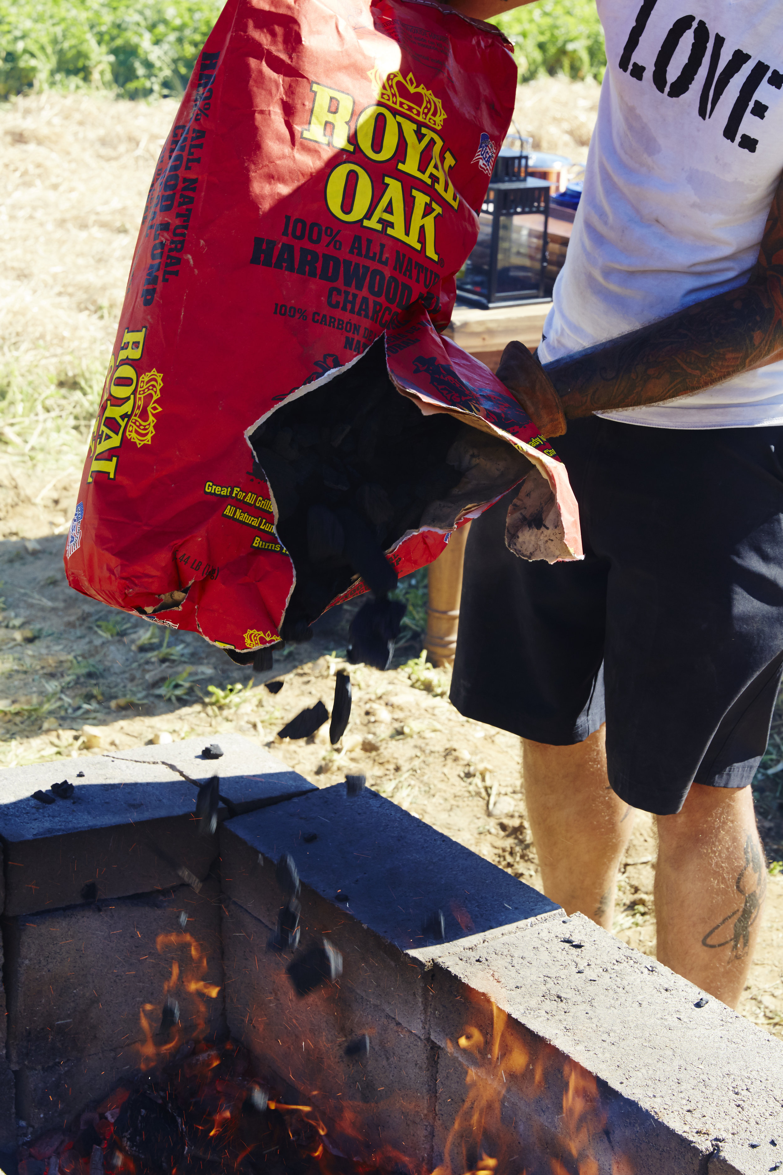 Disclaimer: This is definitely not the recommended way to open a bag of charcoal, it's just the bon*fire way.