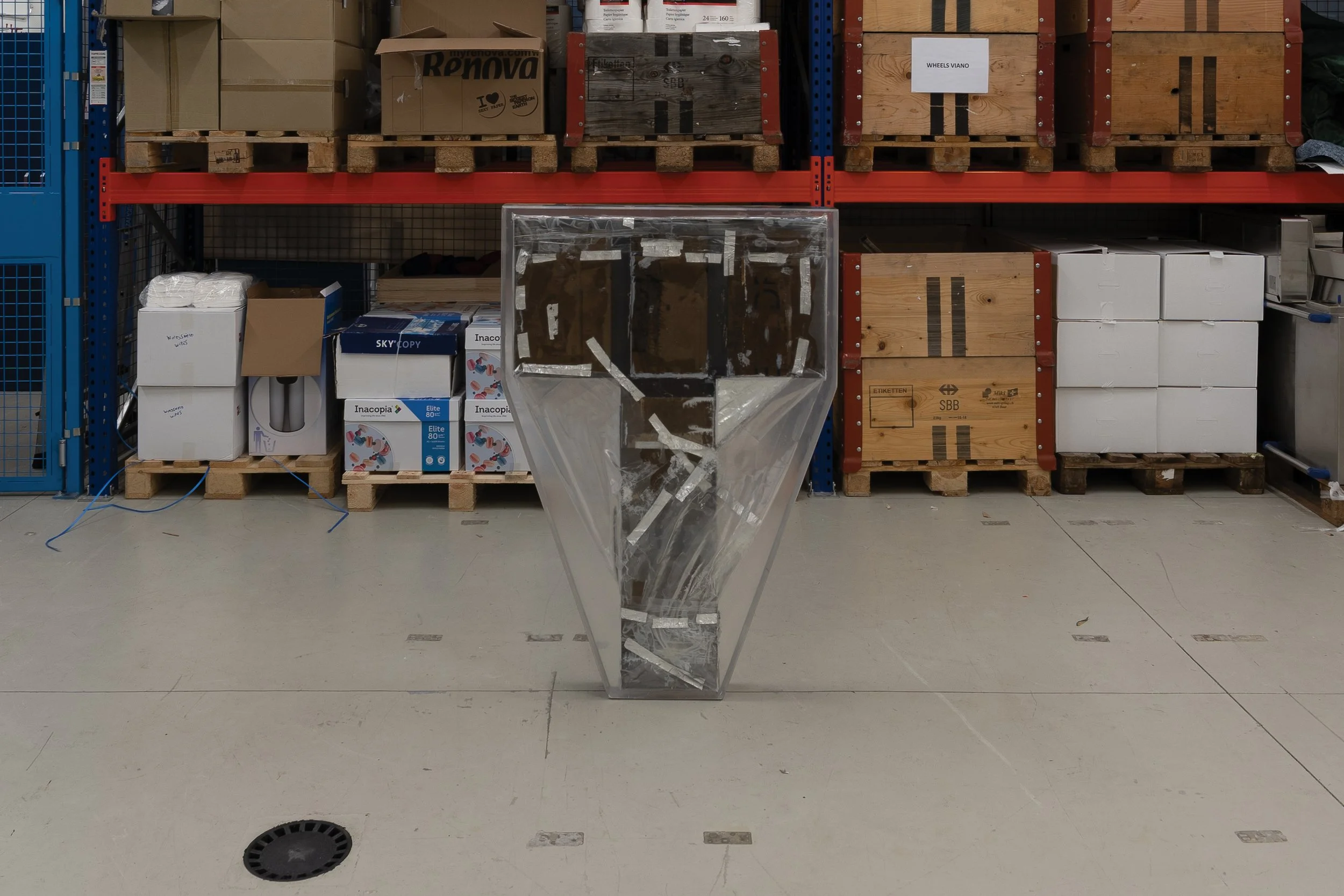  JASON GRINGLER.  TOMB (2026).  'AIR SERVICE' LO BRUTTO STAHL, BASEL. JUNE 15 - JUNE 21 2026.  FAILED ARTWORK, ALUMINUM TAPE, CARDBOARD, STEEL, PLASTIC WRAP, ADHESIVES, PACKING TAPE, EPOXY, DETRITUS AND WAX.  11 X 85 X 125 CM. 