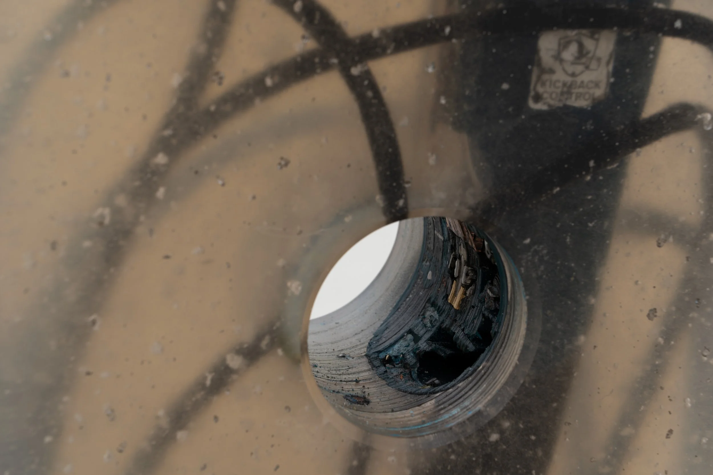  JASON GRINGLER.  TOOL (1) (ANGLE GRINDER) (2021) (DETAIL).  'INAUGURATION' LO BRUTTO STAHL, PARIS. APRIL 1 - JUNE 3 2023.  ANGLE GRINDER, RESIN,  ALUMINUM TAPE, SILICONE, DUST.  11 X 26 X 51 CM. 