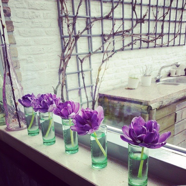 Using shot glasses to create a bud vase composition. 