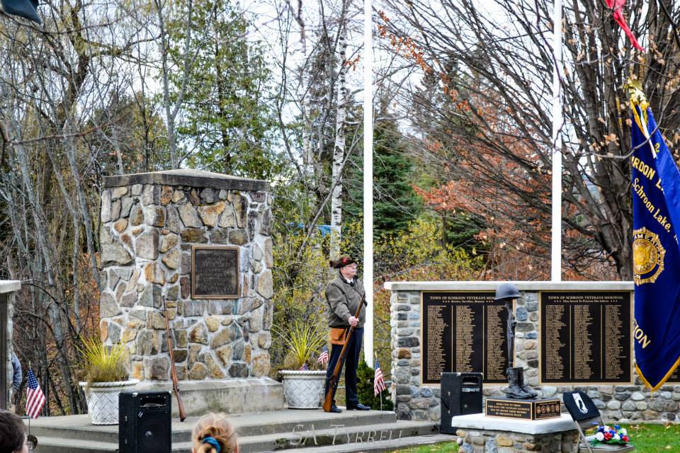 Photo Courtesy of Sharron Tyrrell. Veteran Dave Insull stands at attention during the Schroon Lake Veterans Day Ceremony&nbsp;