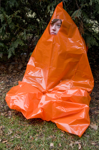 You can create a quick shelter rom rain or cold using a heavy-duty trash bag with a hole cut out for your face.