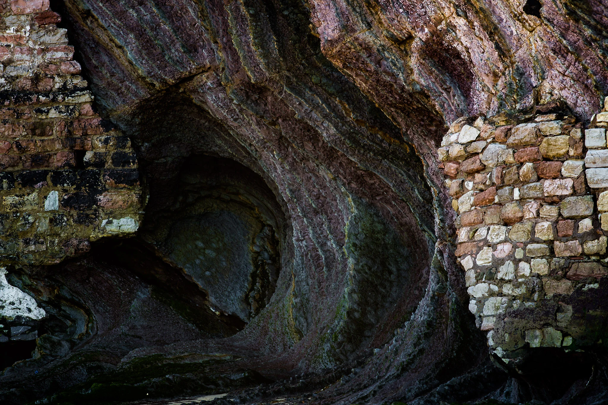 Water eroded bricks and rocks, San Sebastian, Spain