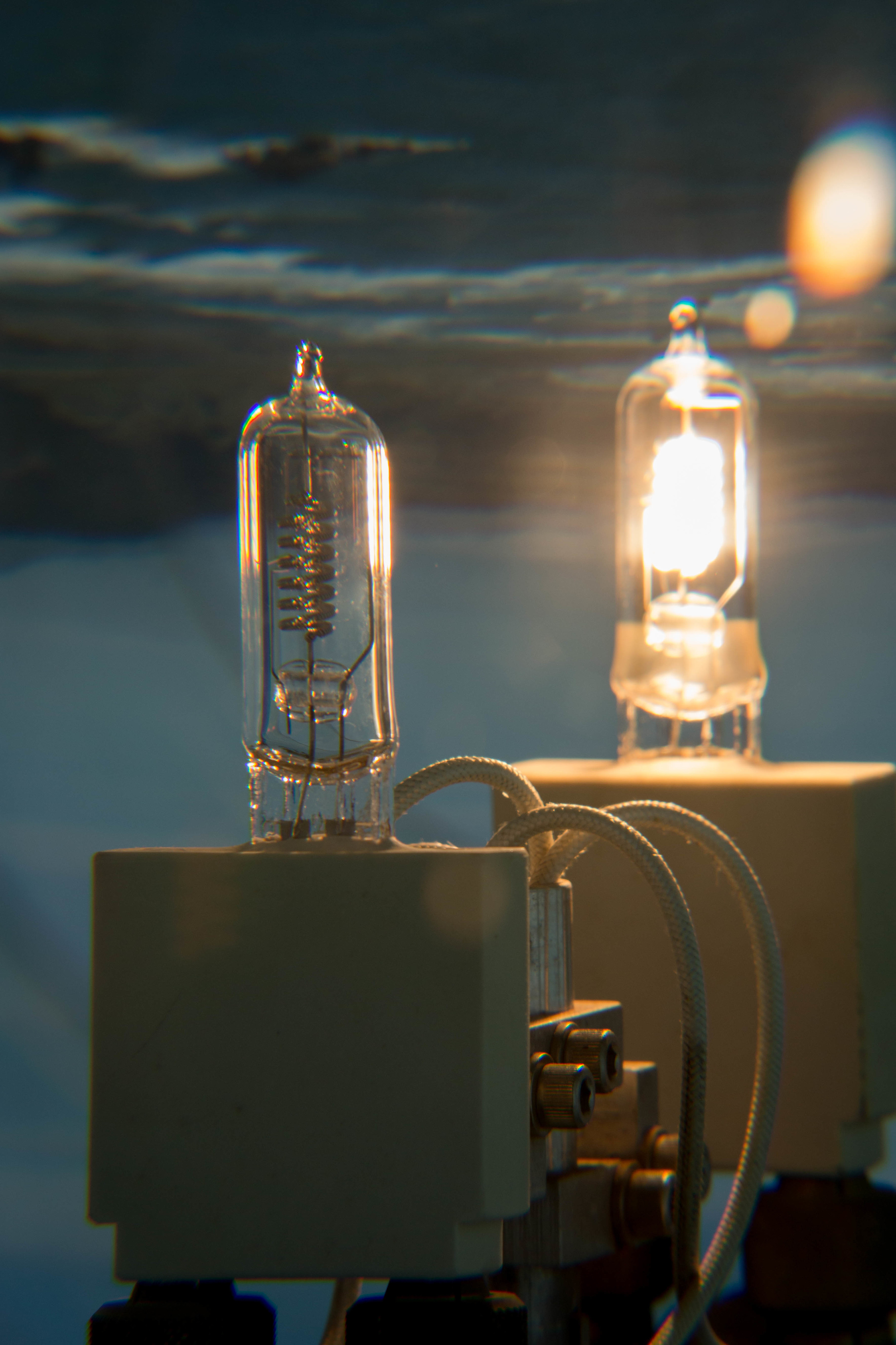 Halogen bulbs inside the Cape Blanco lighthouse Fresnel lens. Yes that is the ocean in the background.