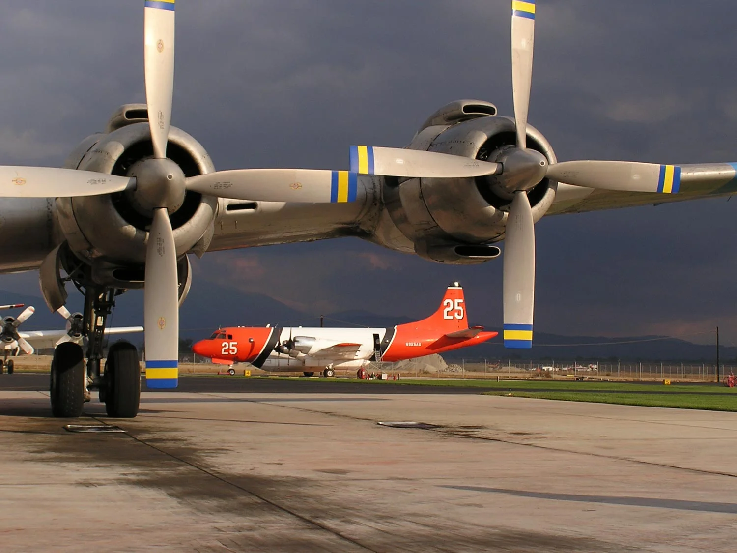 Waiting for the Call P3 Orions, and a Douglas DC-7 (I think ,based on the four-bladed prop) wait on the ramp at San Bernardino Tanker Base during the Old Fire. I saw so many jaw dropping sights that I didn’t have time to catch when I was working, but this is still one of my favorites for how T-25 is framed between the props.