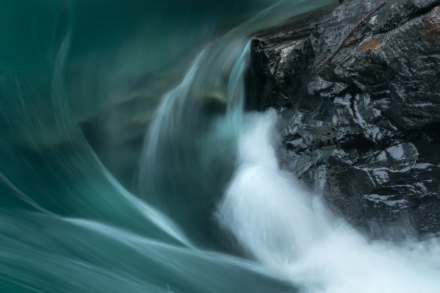 Cascade detail, Mt. Robson NP, British Columbia I love the curve of the water, the blue from a rainy day sky, and the texture of the rock. Although the water looks soft, we know the rock eventually loses to the river. Liquid defeats solid. But for now it is a battle.