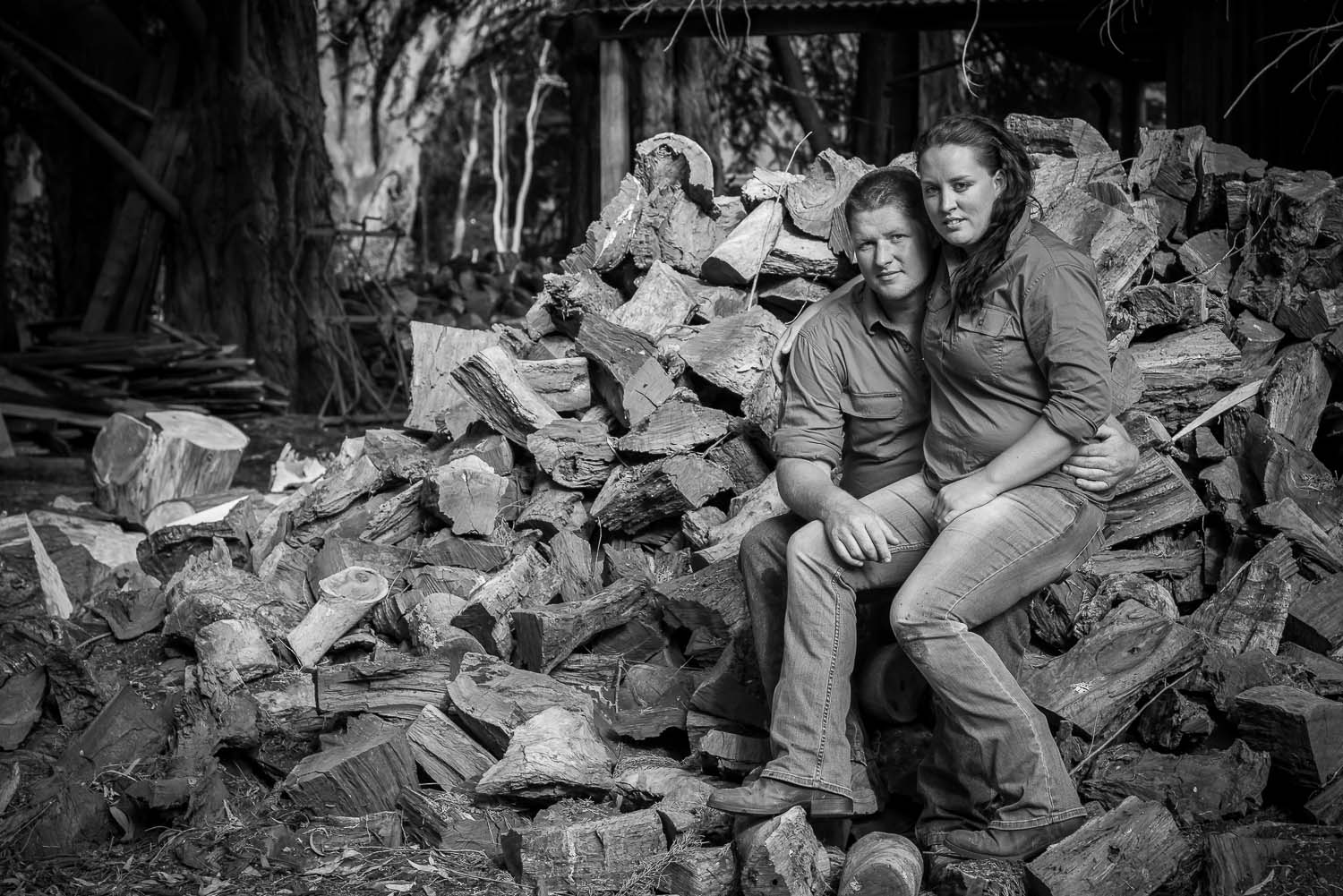 Couple pictured on wood pile