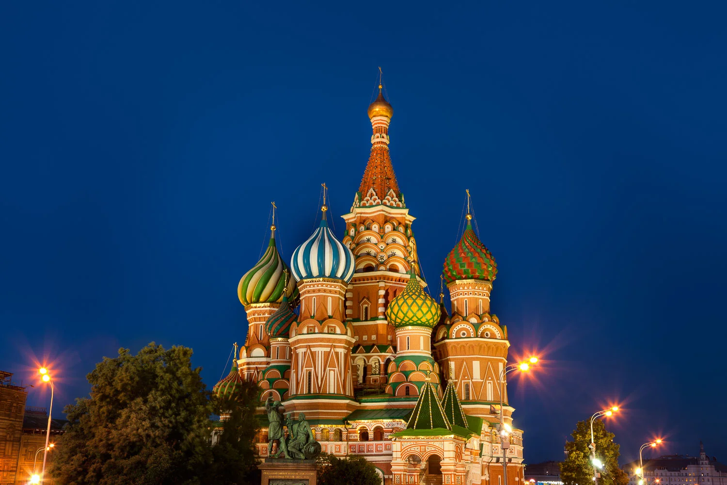 St. Basils Cathedral, glowing against a deep blue night sky Red Square, Moscow