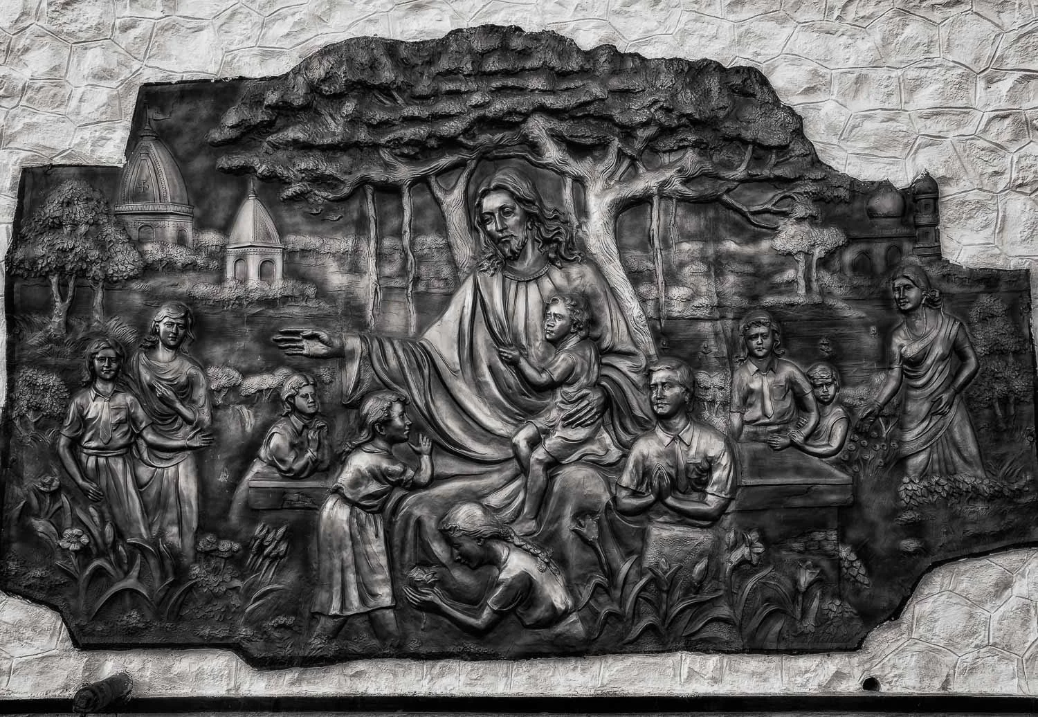 A copper relief of Jesus Christ , in an idyllic setting, on St. Thomas Mount in Chennai, India .