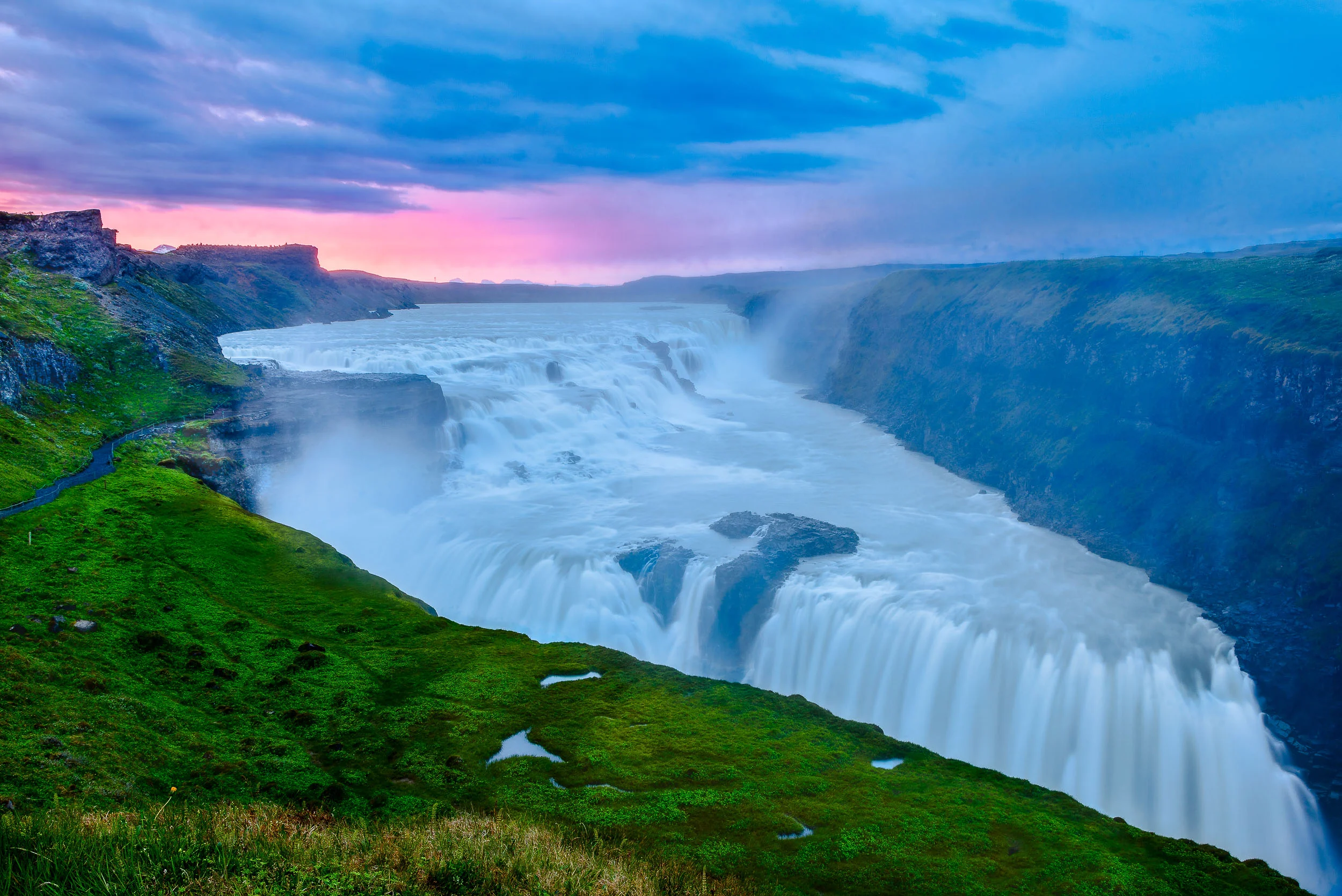 The spectacular Gullfoss waterfall in southern Iceland photographed, through the spray, during the afterglow that followed a beautiful sunset.