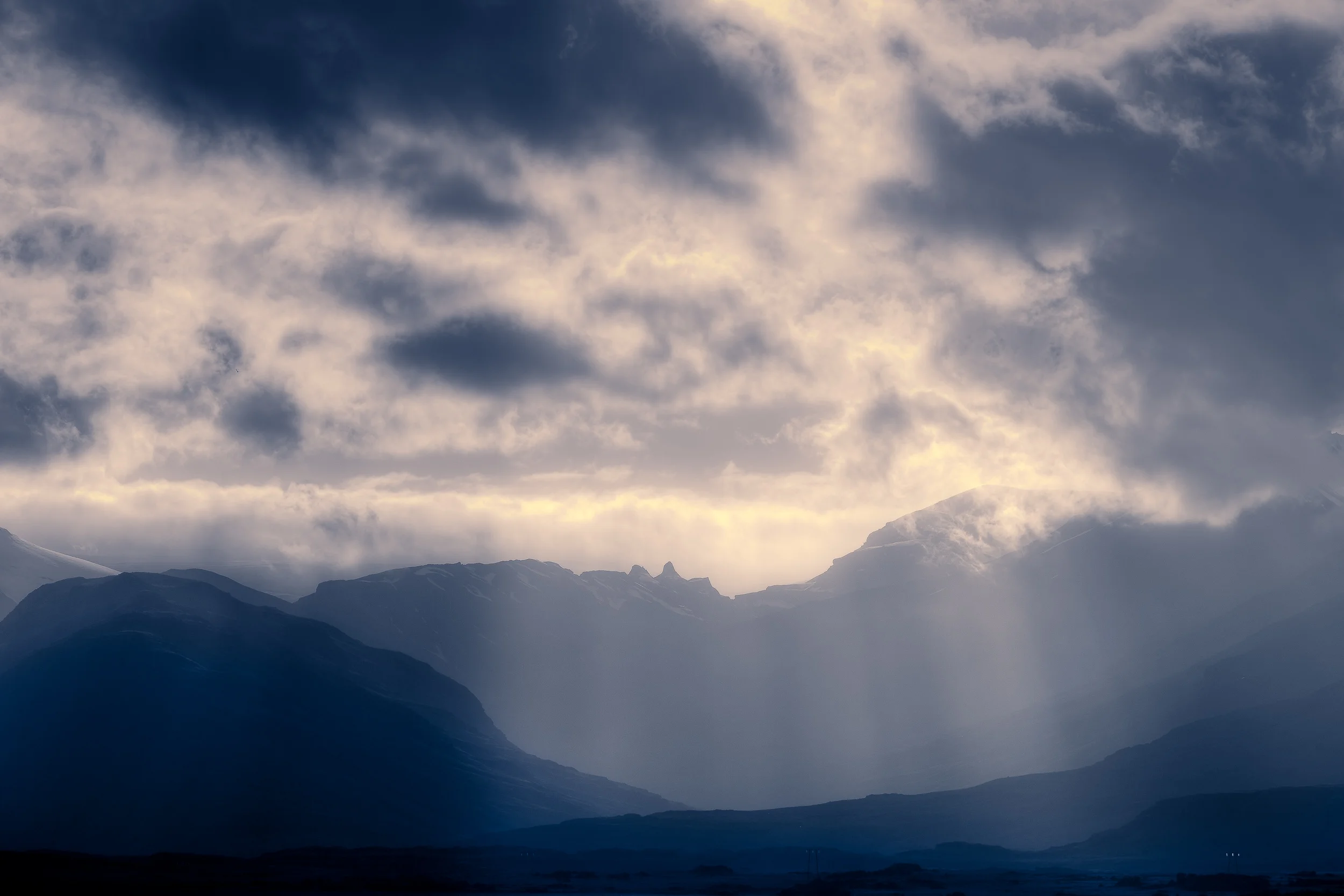 Magnificent 'God Rays' illuminate the landscape in the Highlands region of Central Iceland .