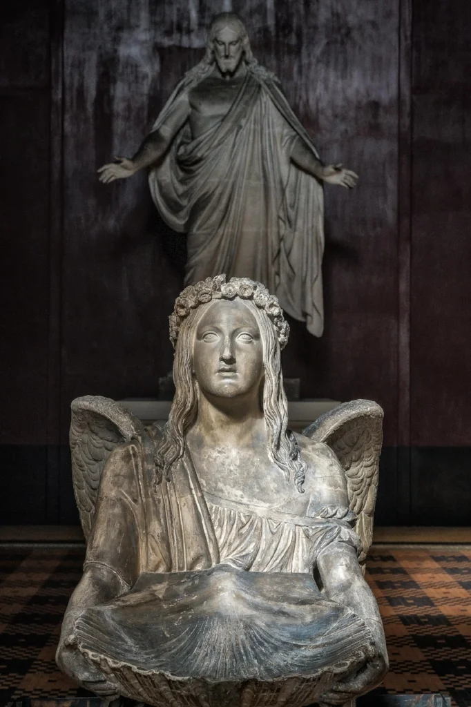 Angel and christ statues at Thorvaldsens Museum in Copenhagen, Denmark .