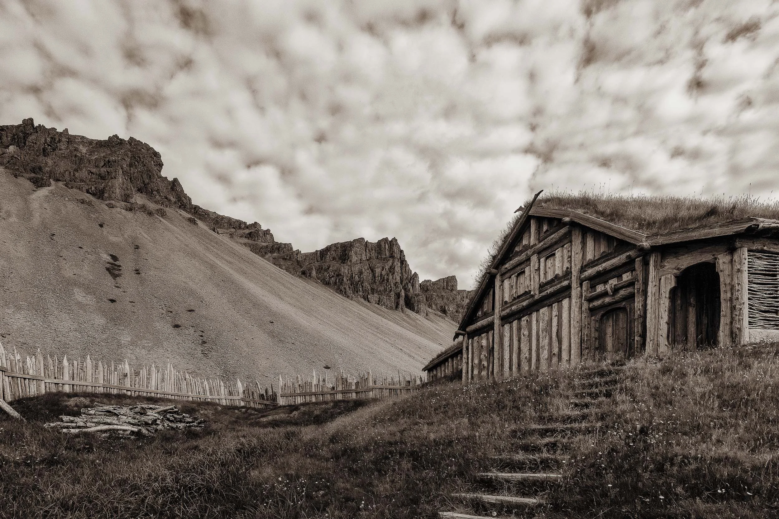 A replica of a Viking village in a dramatic setting in rural Iceland .