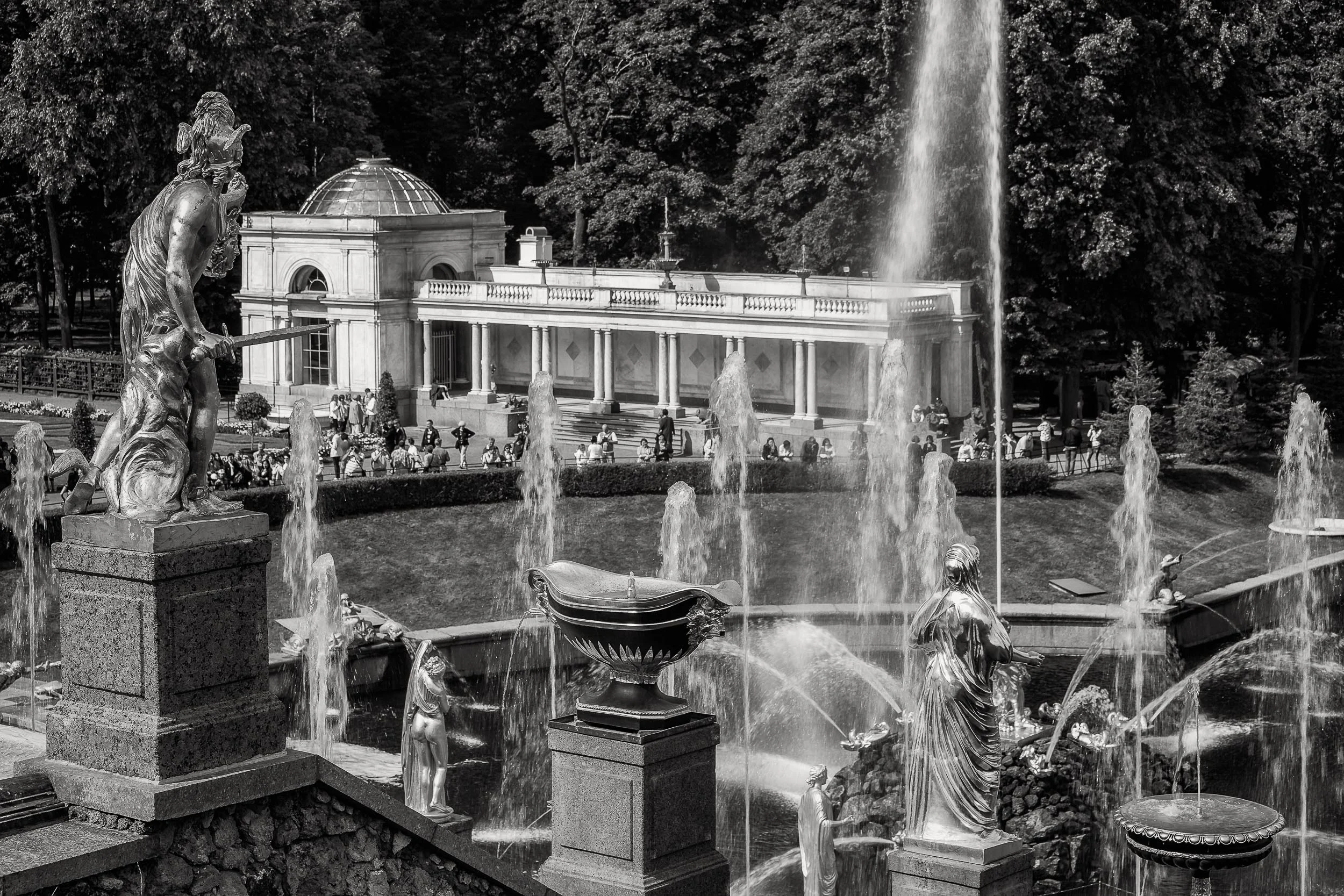 A black and white image showing a rear view of the Grand Cascade at Peterhof Palace near St. Petersburg, Russia .
