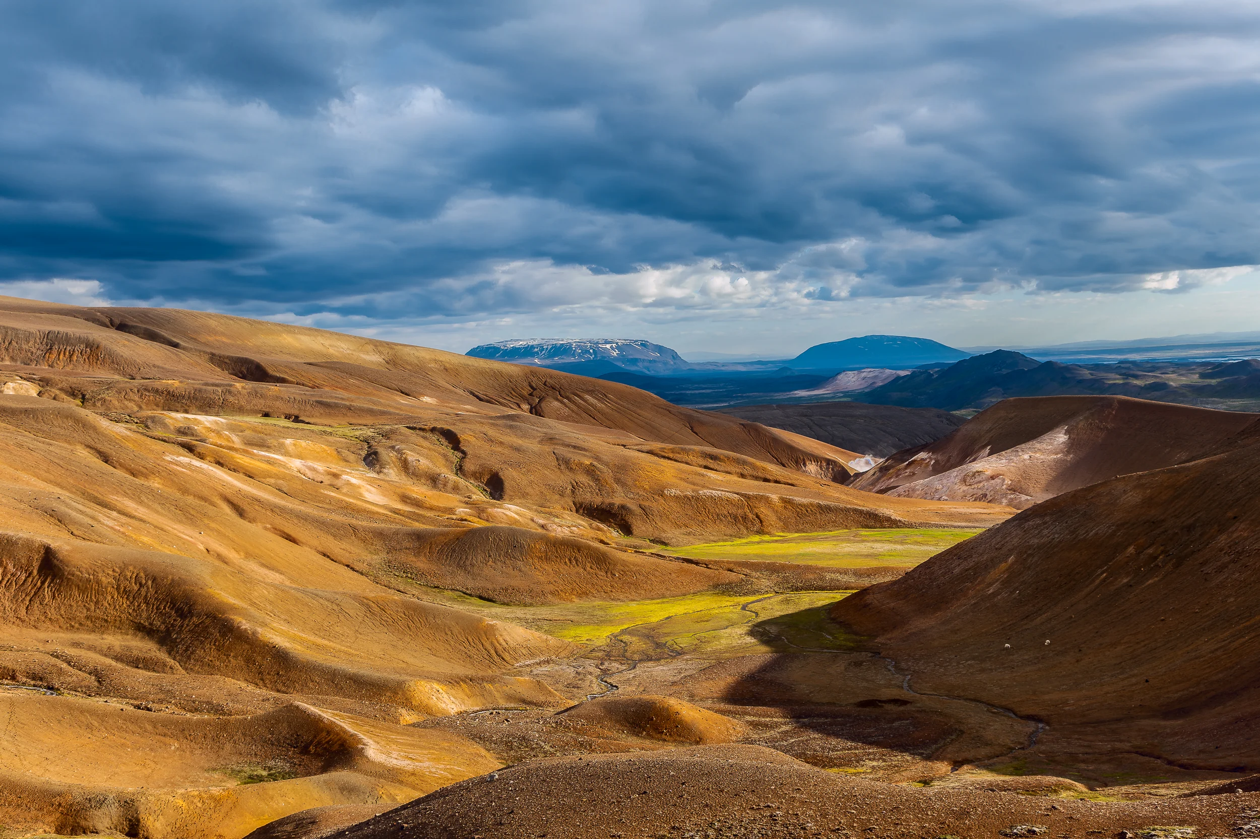 A lush valley between volcanic hills near the Viki crater in spectacular countryside near Myvatn Lake in Northern Iceland .