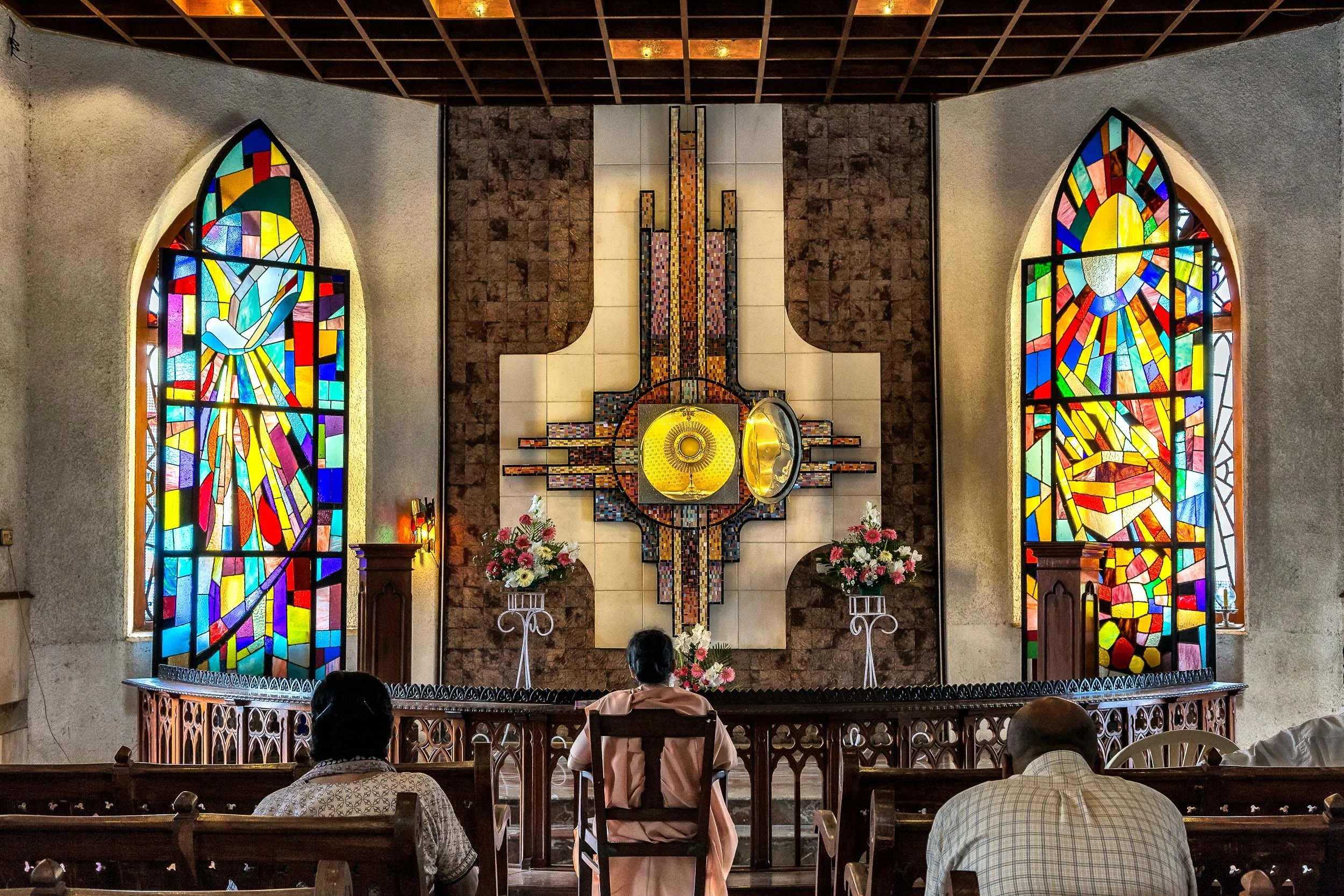 Devotees at prayer and tabernacle at the Santhome Basilica in Chennai, India .