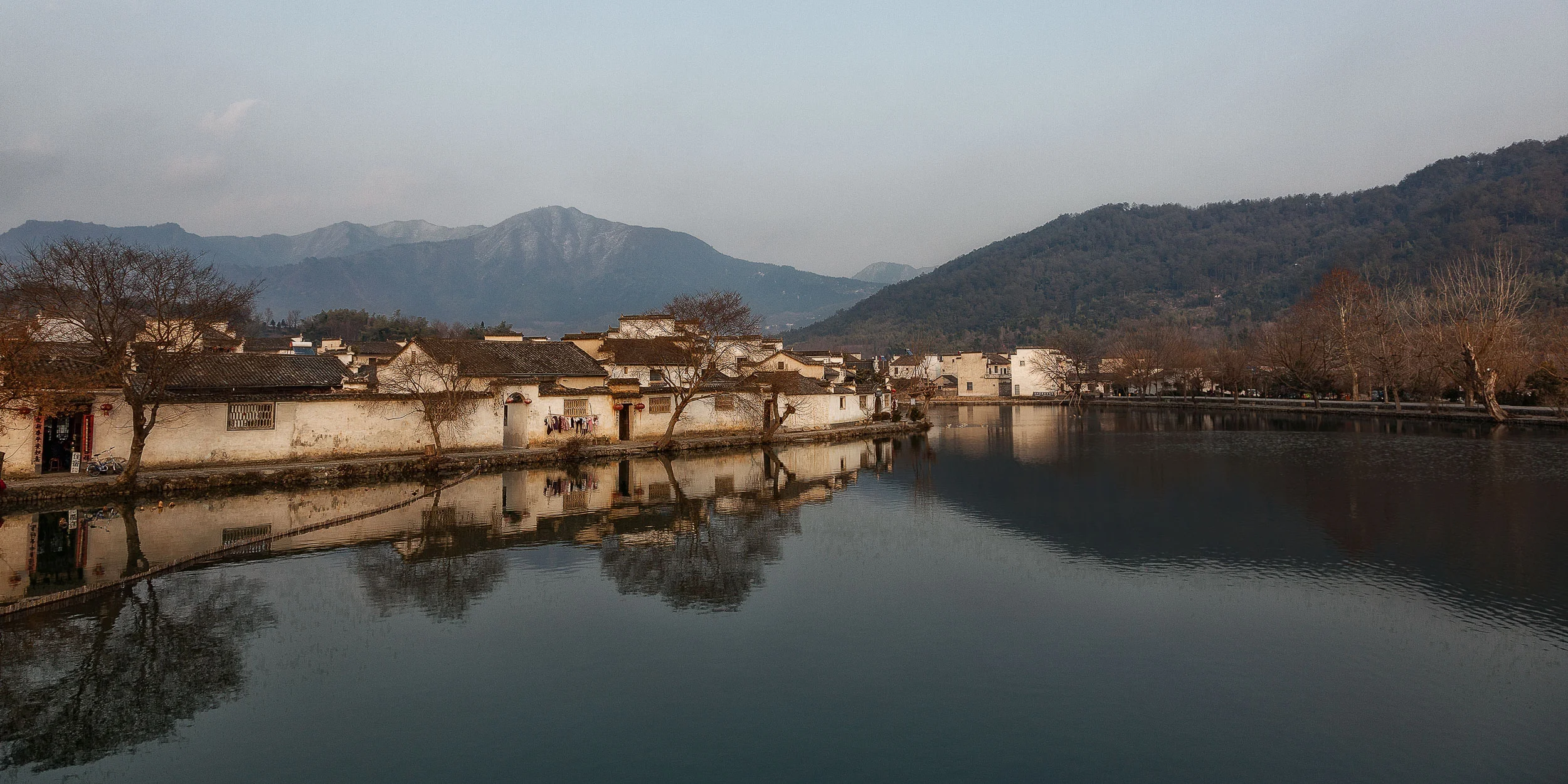 The spectacular Hongcun village at sunset in Anhui Province, China . It's a scene that could have been recorded 100 years ago.
